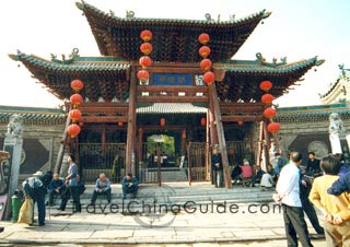 A double-eave wooden arch in front of the temple
