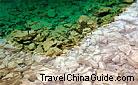 Multi-color Lake (elevation 2,995 meters) covers an area of 5,645 square meters, with a depth of 6.6 meters. It is situated below the Long Lake and deeply hidden among the highly elevated forests. 0005232
