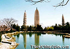 Three pagodas stand together.