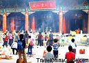 People burn incense in Taoist temple for good luck