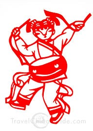 The paper cut with the image of a girl playing waist drum during Chinese festival