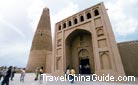 Stand in front of the tower and admire the Islamic-style architecture