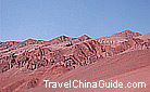 Under the bright sunshine, the Flaming Mountain looks rust red.