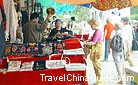 Visitors are making a deal with the local Uygur people.