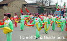 Women in a village of Xian are doing the Yang-ge dance to celebrate the Lantern Festival. 0053780