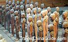 Naked pottery figures standing in line are arranged in a rectangular formation in the Hanyangling Mausoleum.