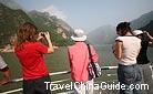 Tourists take photos when they see the elegant Wu Gorge.