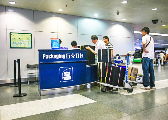 Luggage packaging counter in an airport