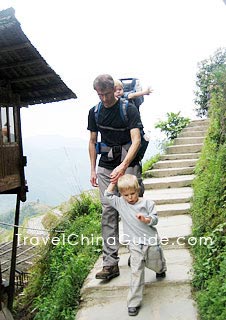 Tourists travel on foot in Longsheng