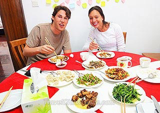 Joseph and Laura Dining in a Local Family