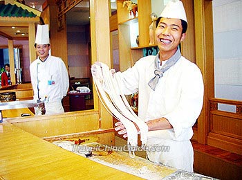A chef is making Lanzhou Hand-Pulled Noodles