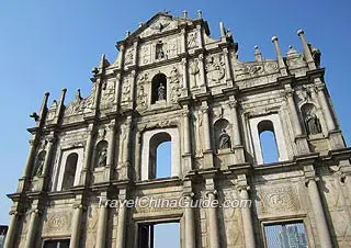 The front facade and grand stone stairs of the church 