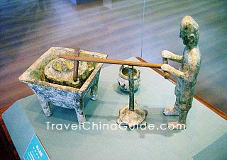 Bronze man figurine turning a millstone, Eastern Han Dynasty (25-220A.D), Jingzhou Museum.