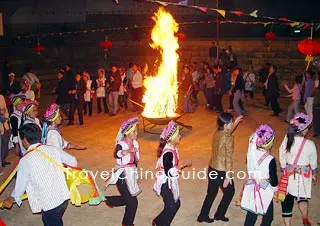 People are dancing around the fire.