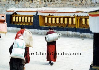 Younger monks serve shopping and cooking