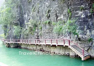 The ancient plank road is submerged in the water