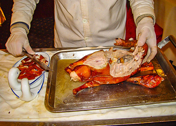 Slicing roast duck, Beijing