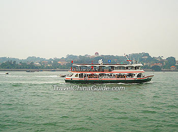 A ferryboat runs between Xiamen Island and Gulangyu Island.