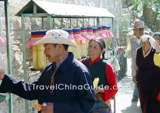 Walk Clockwise around the Prayer Wheels 