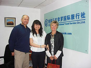 Our tour operator with clients in the front desk of the company