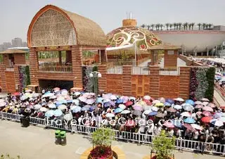 Visitors wait in line before India Pavilion