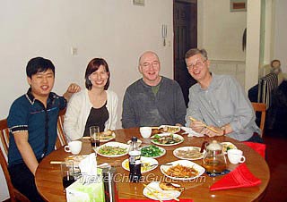 Mr. Peter Anthony Inker, Mr. James Peter Horn & Ms. Lisa Ellen Fischer Having Meal in a Local Family