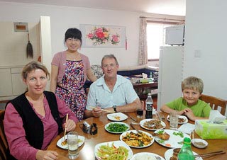 Ms. Sandra Judith Quick's Family Having Dinner with the Chinese Hostess