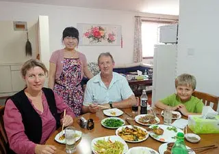 Ms. Sandra Judith Quick's Family Having Dinner with the Chinese Hostess