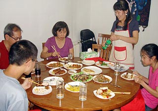 Nelson's Family Having a Meal in a Chinese Family