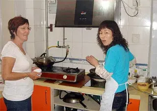 Ms. Nola Learning to Cook Chinese Food