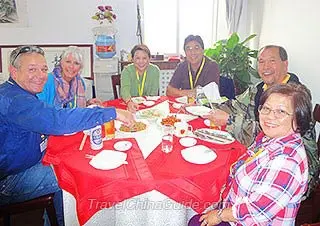 Our Guests Dining in a Local Family