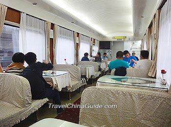 Passengers Enjoy Their Meal in The Dining Car