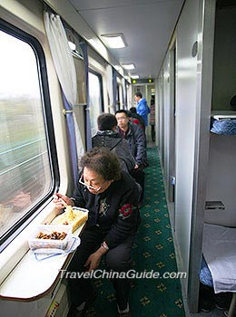 A Chinese Passenger is Eating Instant Noodles