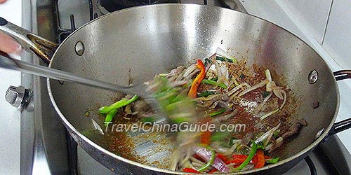 Fry and Mix All Ingredients of Stir-fried Beef With Onions and Peppers