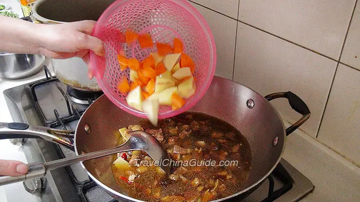 Pouring in Carrots & Potatoes