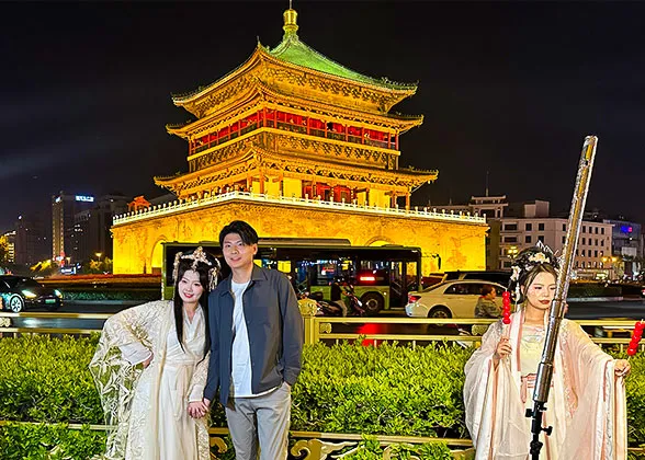 Visitors in Traditional Han Chinese Clothing at Bell Tower