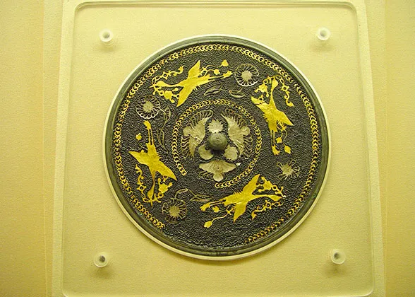 Bronze Mirror Decorated with Four Fluttering Birds