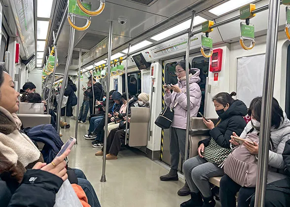 Passengers inside Beijing Metro Train