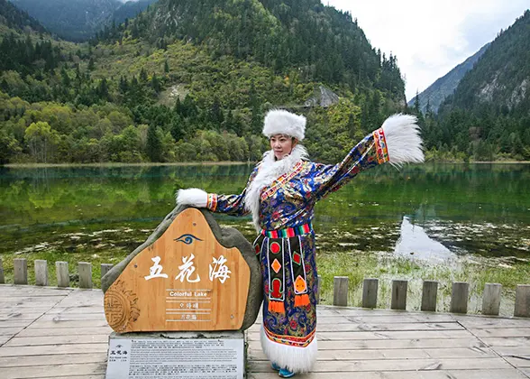 Tourist Wearing Tibetan Clothes to Take Photos