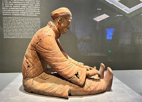 Sitting Figure with Long Robe and Pants