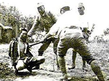 Japanese invaders thrust bayonet into the man