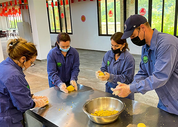 Volunteer Making Panda Cakes