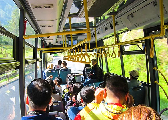 Tourists Riding Shuttle Bus in Jiuzhaigou Tourists Riding Shuttle Bus in Jiuzhaigou