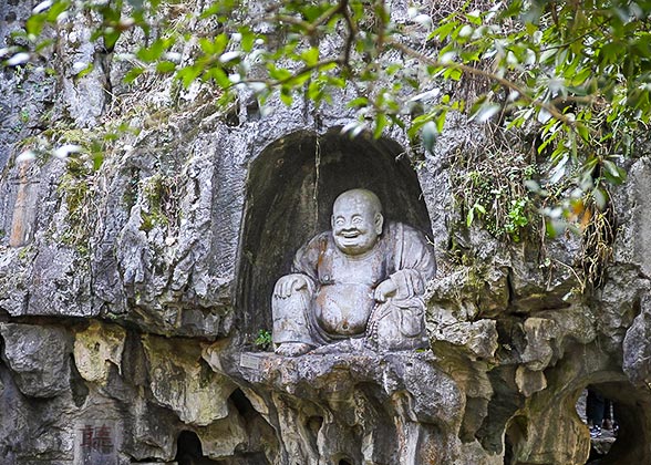 Buddha Statue on the Mountain Wall of Peak Flown from Afar Buddha Statue on the Mountain Wall of Peak Flown from Afar