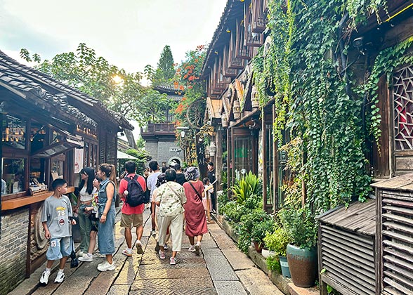 Tourists Strolling in the Alley of Wuzhen Water Town Tourists Strolling in the Alley of Wuzhen Water Town
